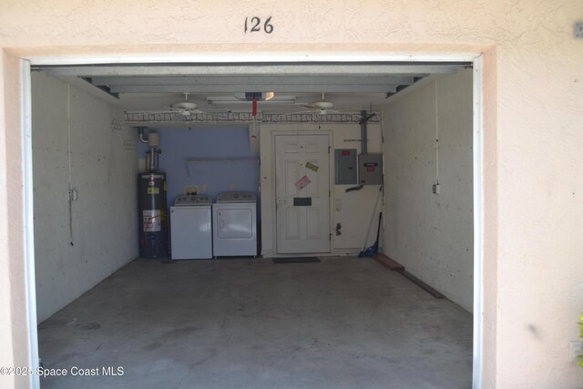 126 Plover Ln Unit 632, Rockledge, FL 32955 - garage with washing machine and clothes dryer, water heater, and electric panel