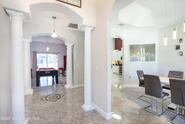 dining room featuring visible vents, marble finish floor, baseboards, and ornate columns