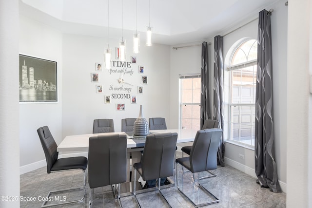 dining room featuring baseboards