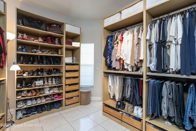 walk in closet featuring tile patterned flooring