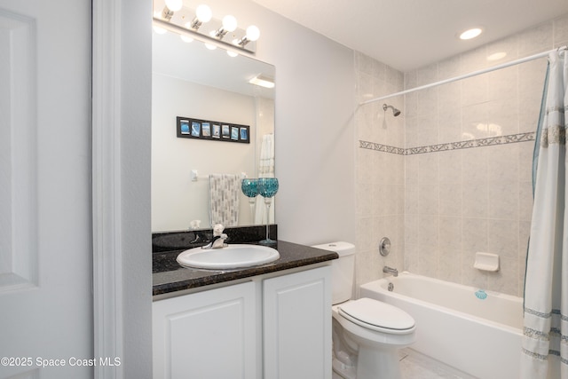 full bathroom featuring shower / tub combo with curtain, vanity, and toilet