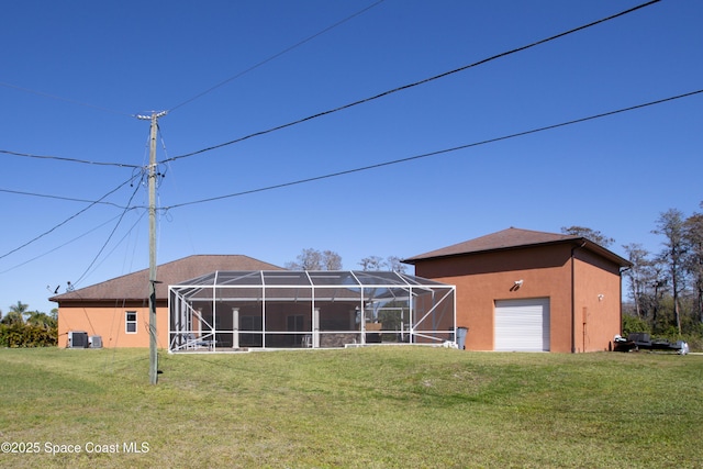 view of outbuilding featuring central AC unit and a garage