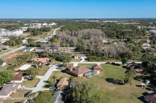 drone / aerial view featuring a view of trees