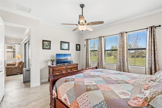 bedroom featuring crown molding, light wood-style flooring, baseboards, and ceiling fan