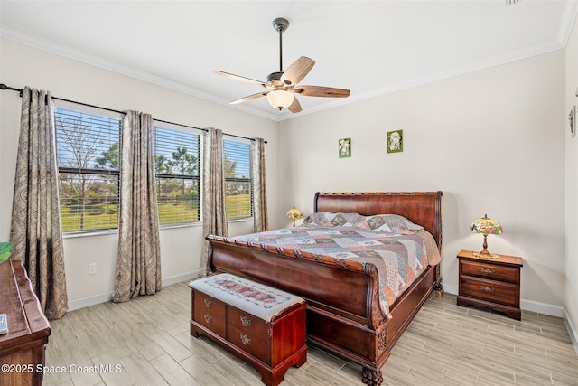 bedroom with crown molding, baseboards, and wood tiled floor