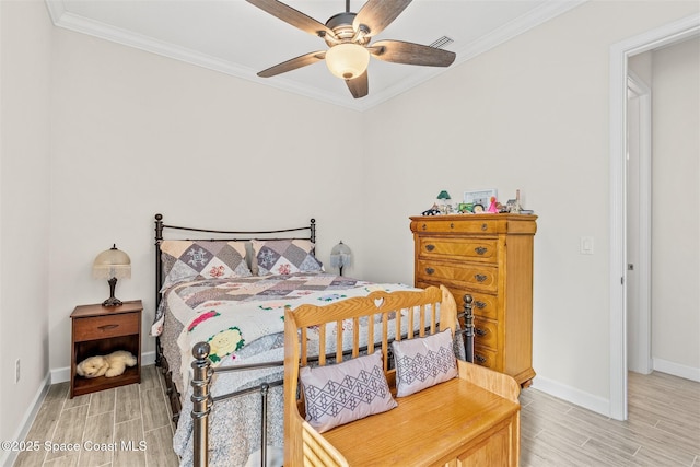 bedroom with crown molding, a ceiling fan, baseboards, and wood finish floors