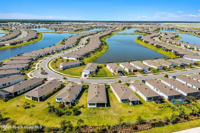 aerial view with a residential view and a water view