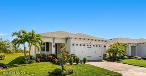 view of front facade featuring a garage, concrete driveway, and a front lawn