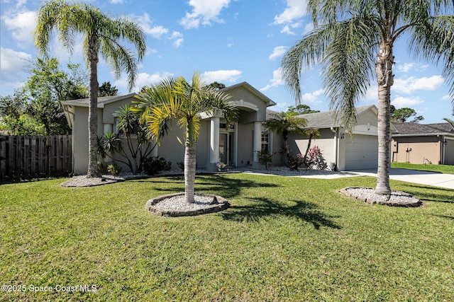 view of front facade featuring a garage, stucco siding, driveway, and fence