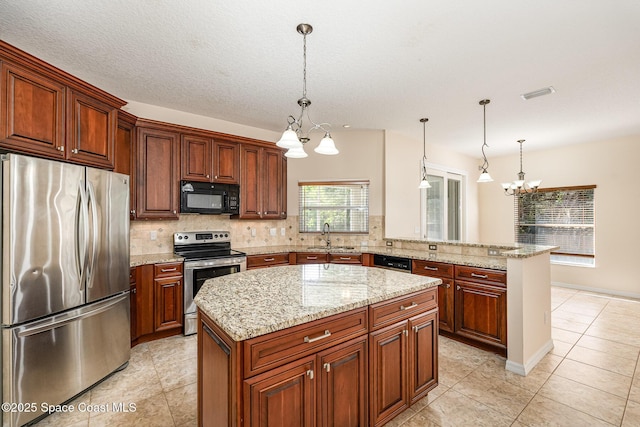 kitchen featuring a chandelier, backsplash, appliances with stainless steel finishes, and a sink