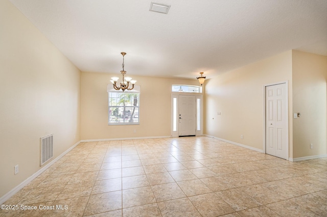 entryway featuring visible vents, baseboards, and a chandelier