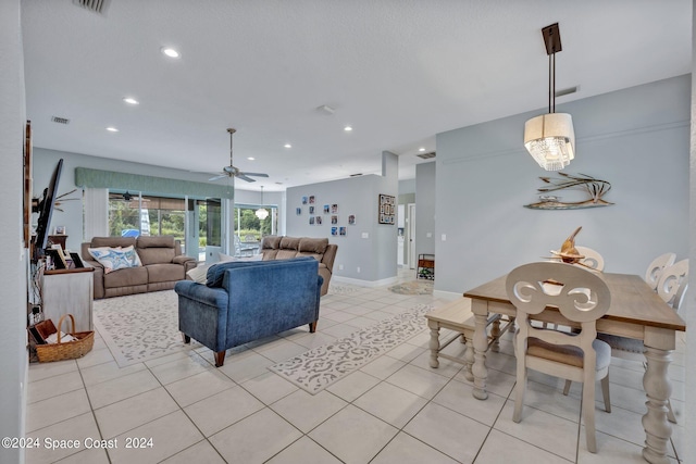 living area with visible vents, baseboards, ceiling fan, recessed lighting, and light tile patterned flooring