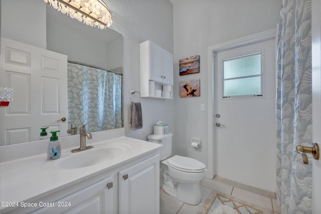 full bathroom with tile patterned flooring, toilet, and vanity