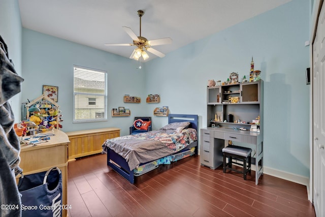 bedroom with baseboards, dark wood-style floors, and a ceiling fan