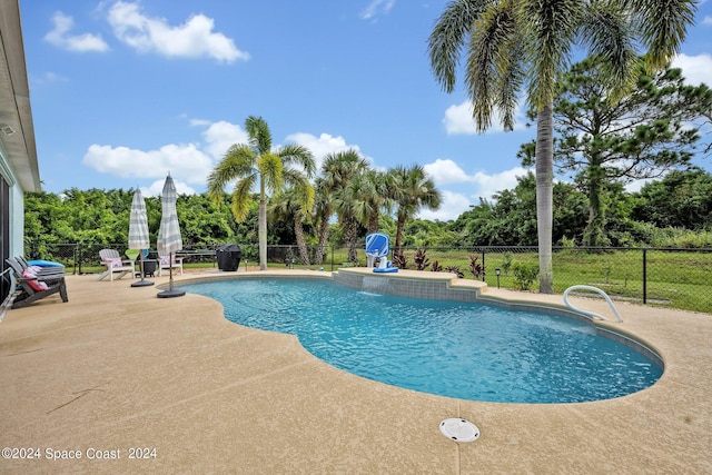 view of pool with a patio, fence, and a fenced in pool