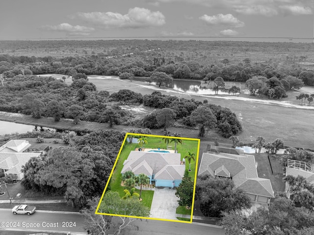 birds eye view of property featuring a water view