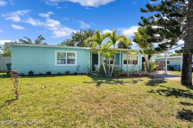 ranch-style home featuring a front yard and fence