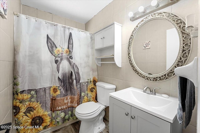 489 Seacrest Ave, Merritt Island, FL 32952 - full bathroom with vanity, tile walls, toilet, and tasteful backsplash