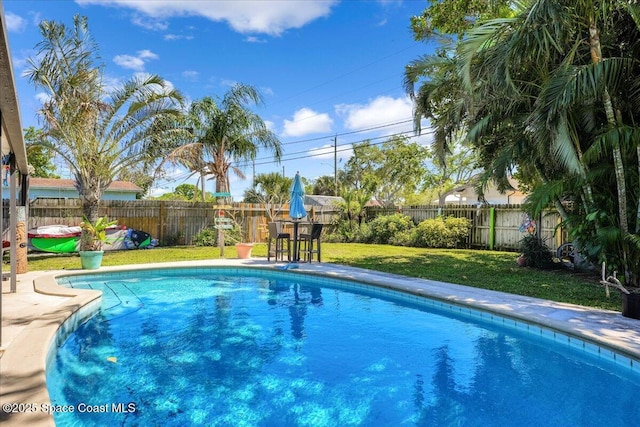 489 Seacrest Ave, Merritt Island, FL 32952 - view of swimming pool with a fenced in pool, a lawn, and a fenced backyard