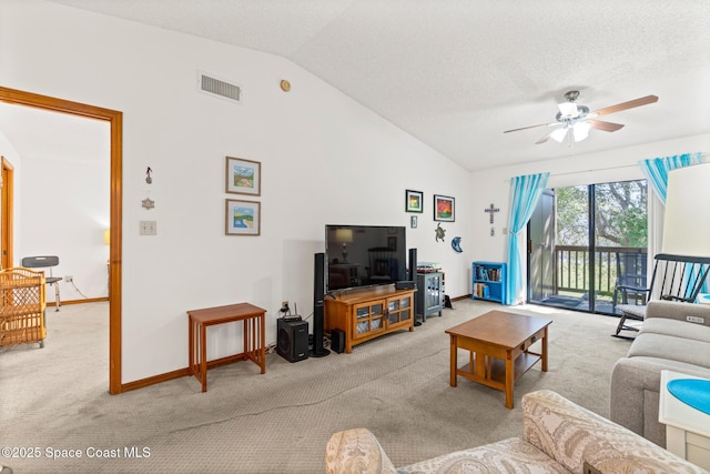 carpeted living area with visible vents, baseboards, vaulted ceiling, a textured ceiling, and a ceiling fan