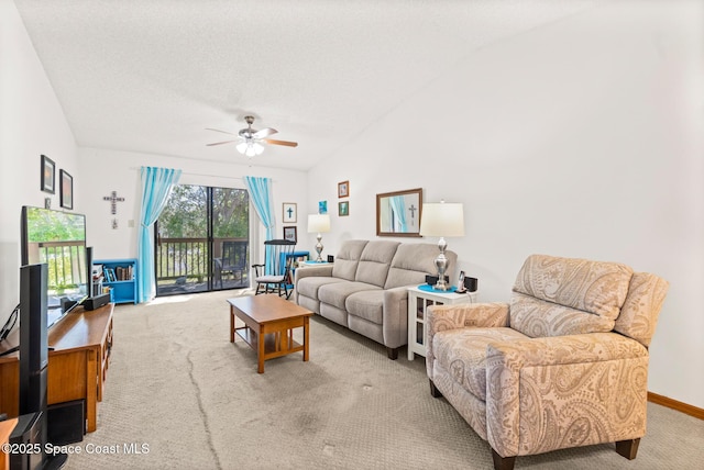 carpeted living area featuring vaulted ceiling, a ceiling fan, baseboards, and a textured ceiling