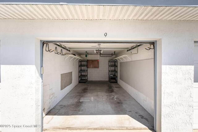 garage featuring a garage door opener