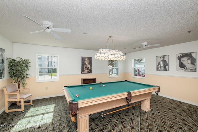 playroom with pool table, a ceiling fan, baseboards, and a textured ceiling