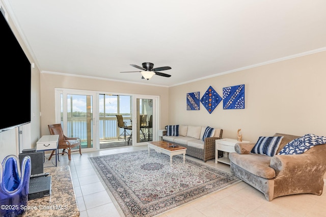 tiled living area featuring ceiling fan, a water view, and ornamental molding