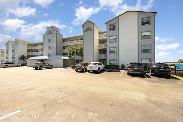 view of property with uncovered parking