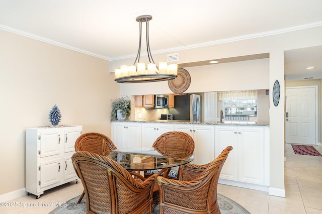 dining room with visible vents, a notable chandelier, ornamental molding, and light tile patterned flooring