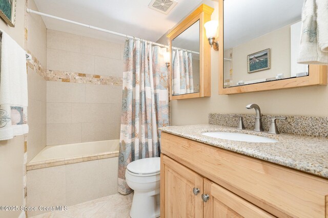 full bath with vanity, visible vents, tile patterned flooring, shower / tub combo, and toilet