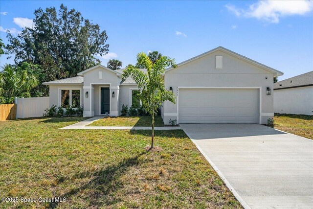 1611 Glendon Dr NE, Melbourne, FL 32901 - ranch-style house featuring driveway, a garage, fence, and stucco siding