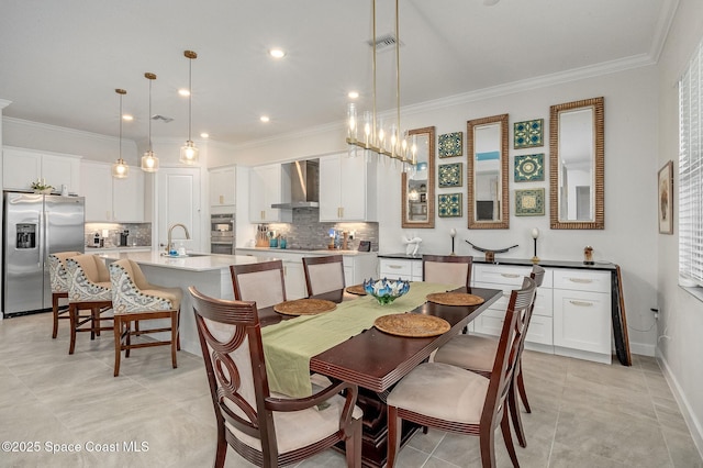 dining room featuring crown molding, light tile patterned flooring, baseboards, and visible vents