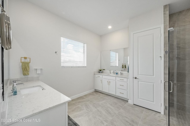 full bath with recessed lighting, a shower stall, vanity, and baseboards