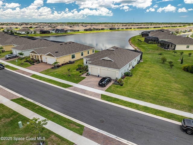 aerial view featuring a residential view and a water view