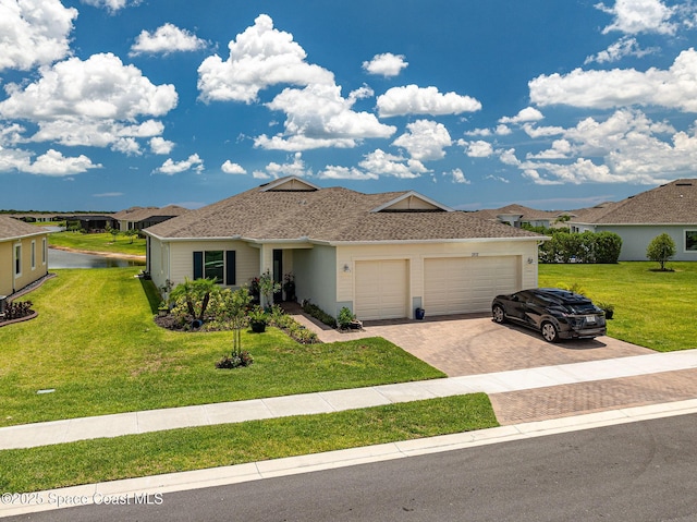 ranch-style home with a front lawn, decorative driveway, a garage, and a shingled roof