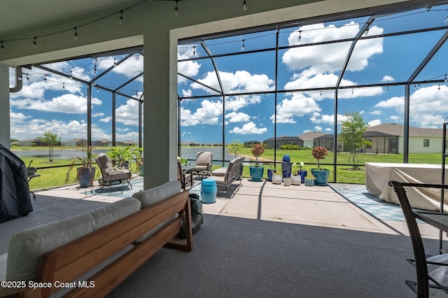 view of patio featuring glass enclosure