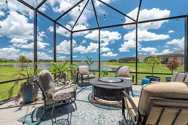 view of patio featuring an outdoor living space, a water view, and a lanai