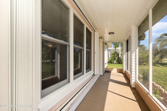 sunroom with wooden ceiling