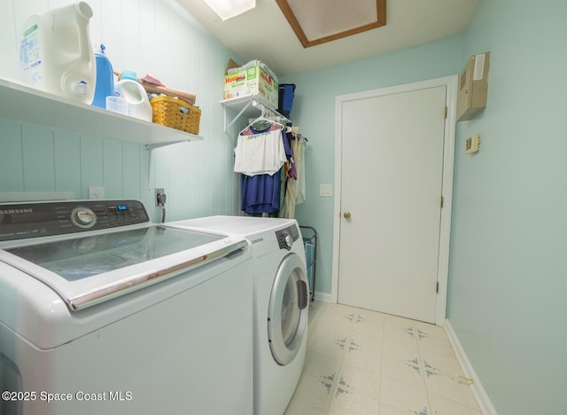 laundry area featuring baseboards, light floors, attic access, laundry area, and independent washer and dryer