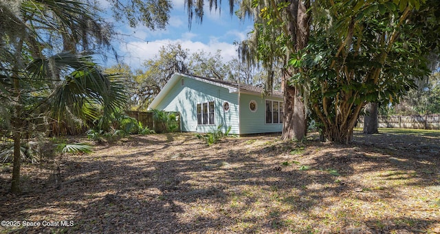 view of side of property with fence