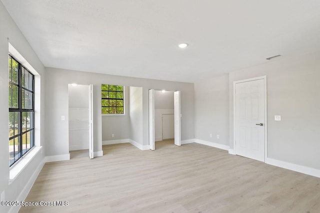 unfurnished bedroom with visible vents, recessed lighting, baseboards, and light wood-style floors