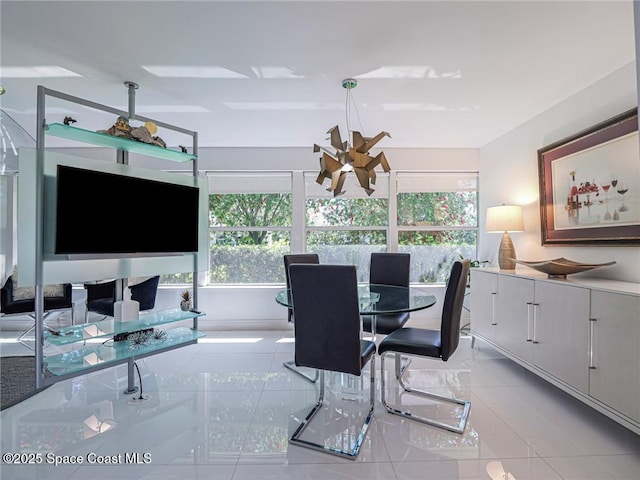 dining space featuring a wealth of natural light and tile patterned flooring