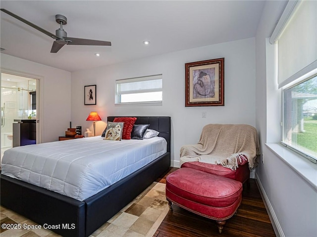 bedroom with a ceiling fan, wood finished floors, ensuite bath, recessed lighting, and baseboards