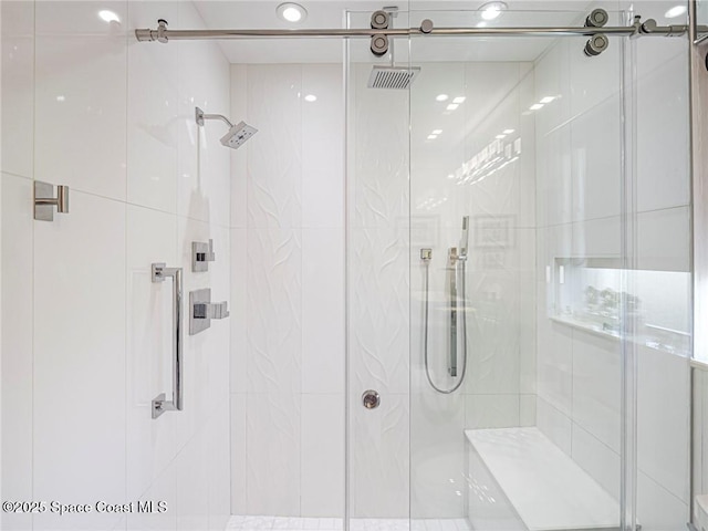 full bathroom with visible vents and a stall shower