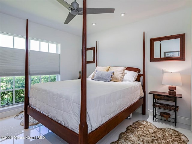 bedroom featuring recessed lighting, baseboards, multiple windows, and ceiling fan