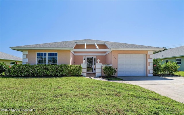 view of front of home featuring stucco siding, concrete driveway, a front lawn, and a garage