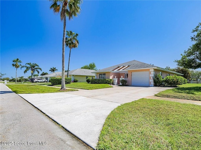 single story home featuring stucco siding, an attached garage, driveway, and a front lawn