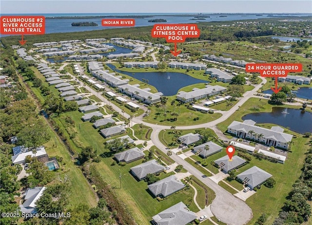 bird's eye view featuring a water view and a residential view