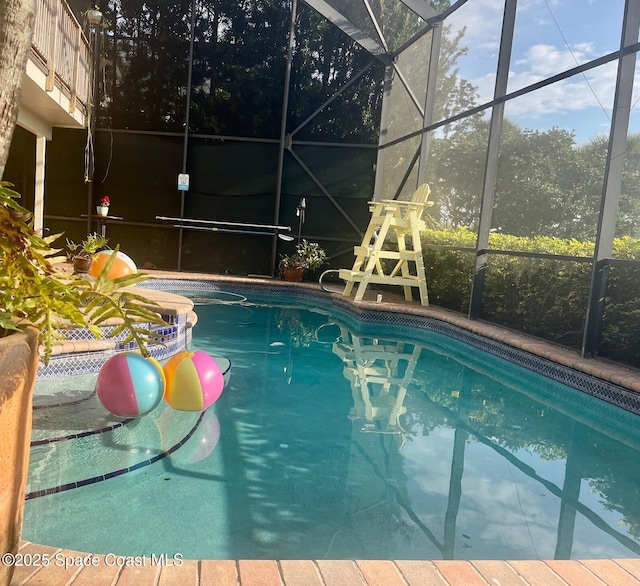 outdoor pool featuring a lanai